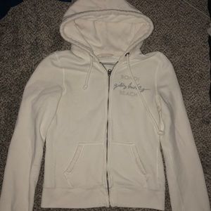 White full zip gilly hicks sweatshirt with hood.